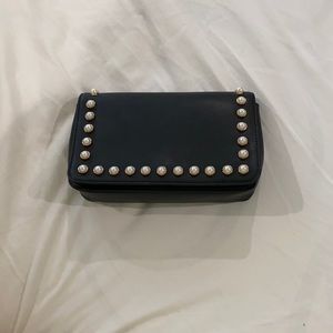 Black handbag with pearl detail